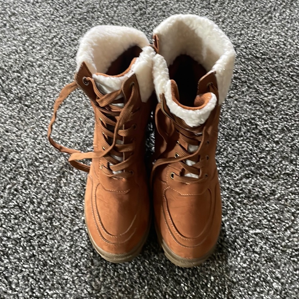 High top boots purchased with matching coat also available .